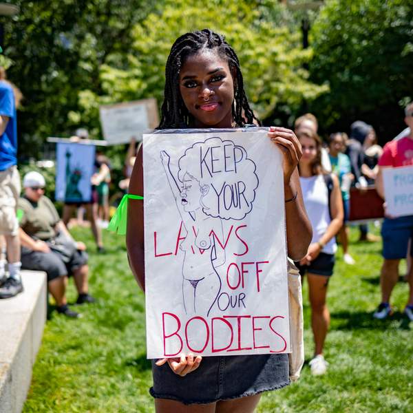a-black-woman-protester-holding-up-a-sign-during-abortion-protest