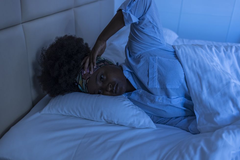 Annoyed-Black-woman-waking-up-in-the-middle-of-the-night