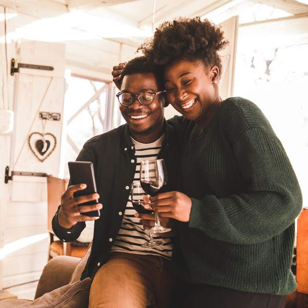 Black couple drinking wine