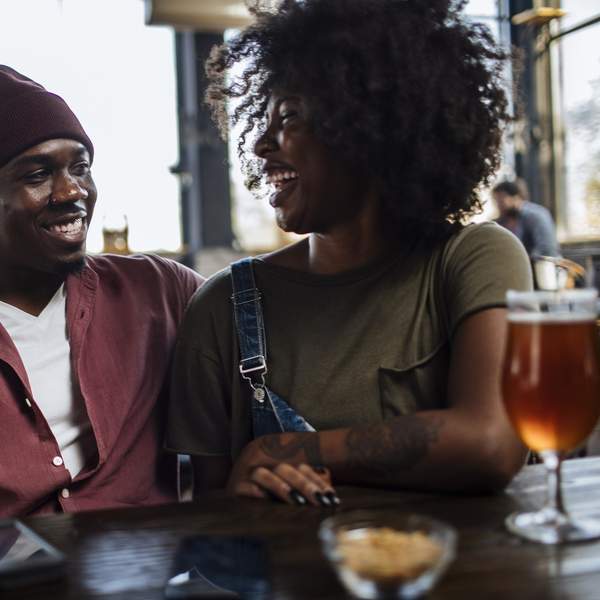 Black-couple-enjoying-a-casual-date-sharing-a-laugh