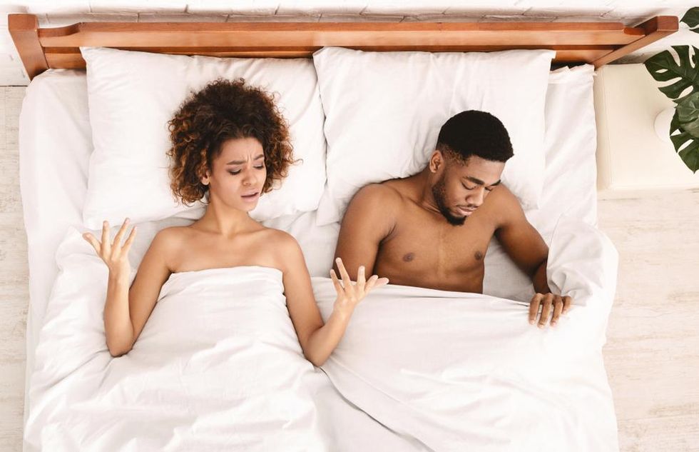 black-couple-in-bed-upset