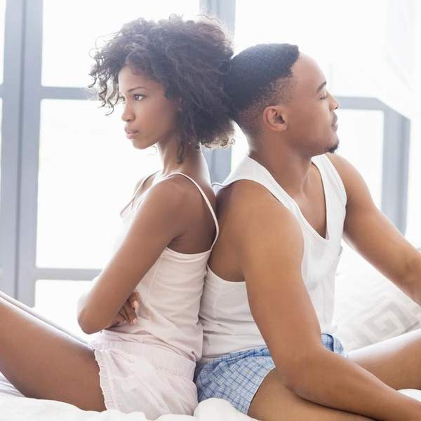 black-couple-in-bed-upset