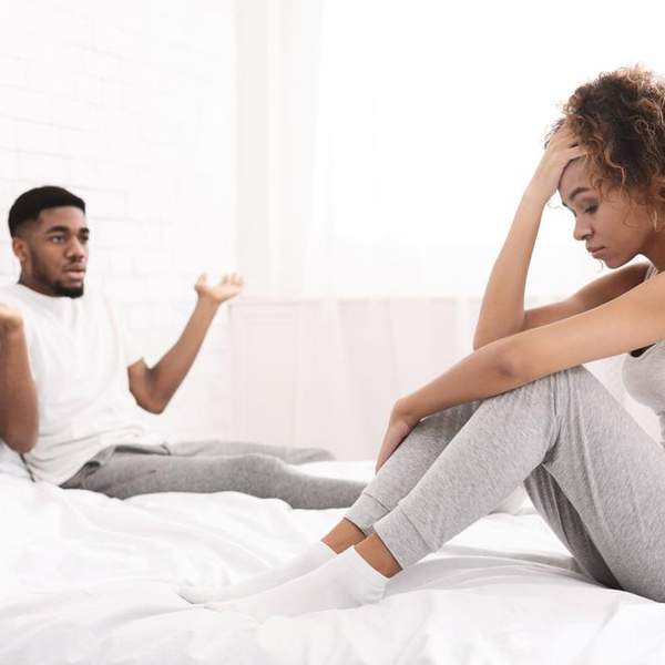 black-couple-in-bed-upset