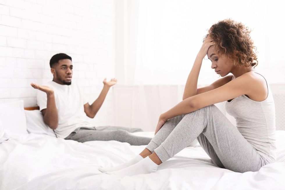 black-couple-in-bed-upset