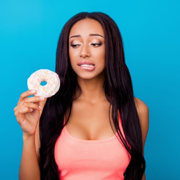 black-woman-eating-sugar-donut