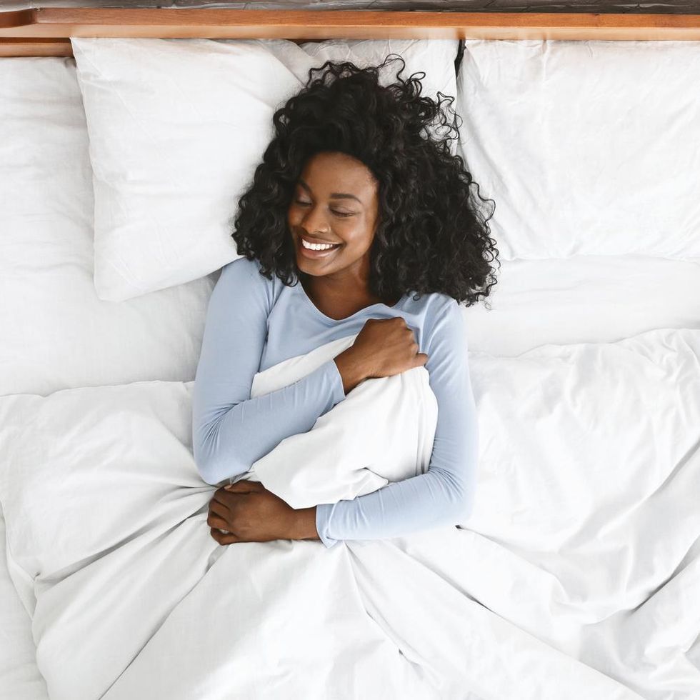 black-woman-in-bed-smiling