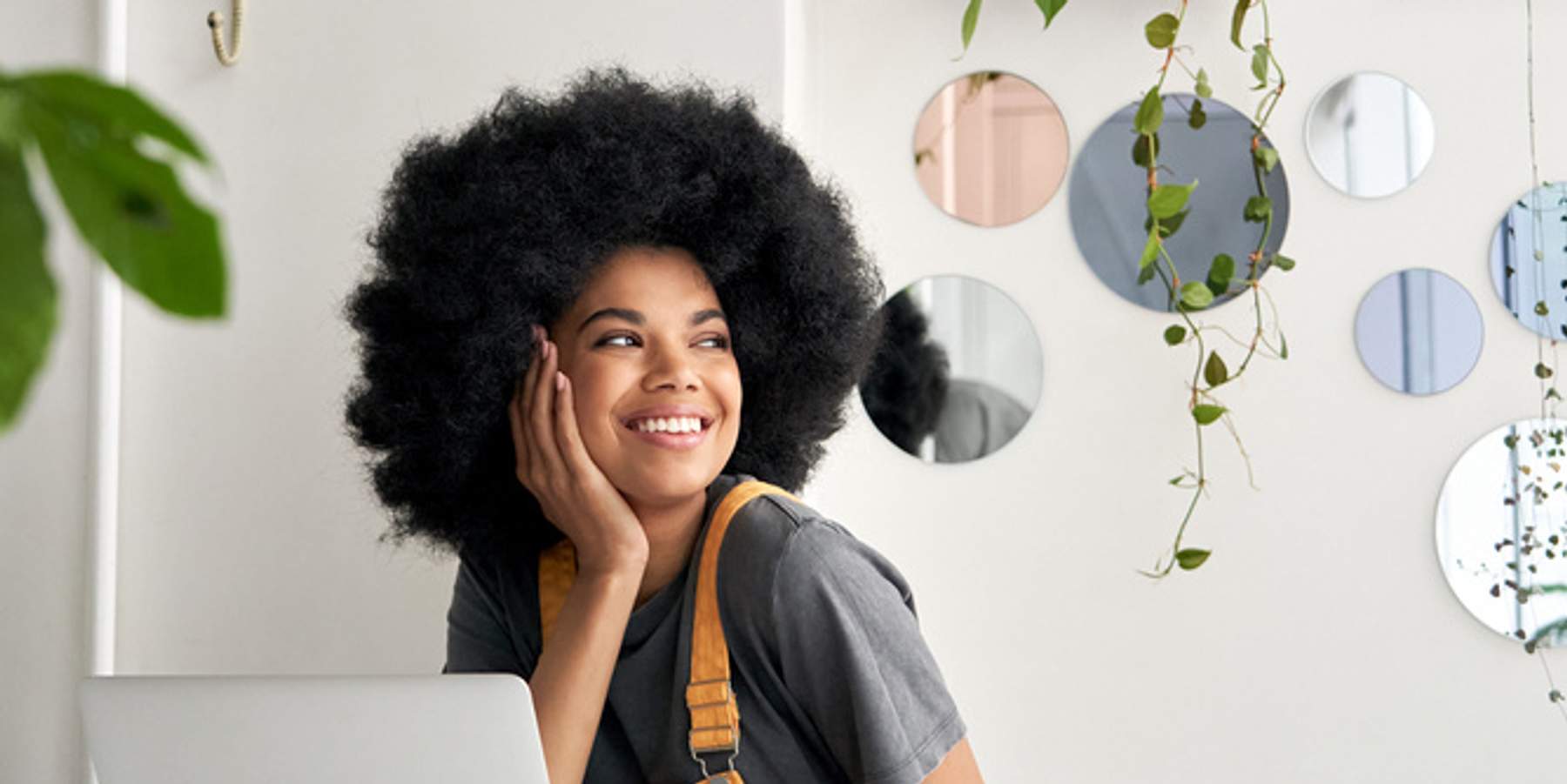 black woman looking out of window