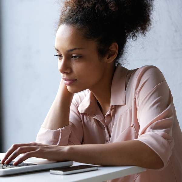 black-woman-searching-on-internet-laptop