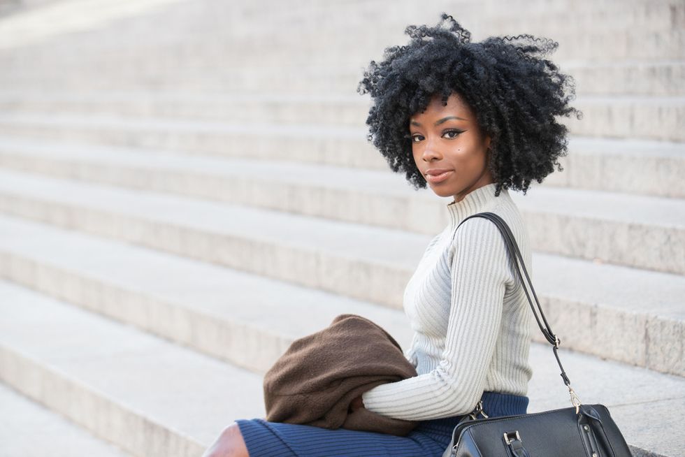black-woman-sitting-on-steps-confident