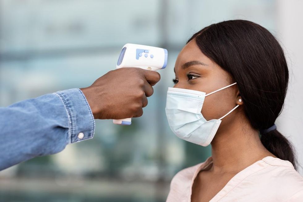 black-woman-temperature-check-travel