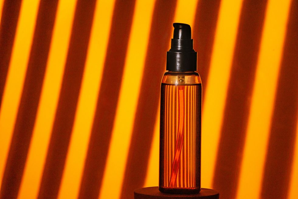 Bottle-without-a-label-filled-with-oil-on-display