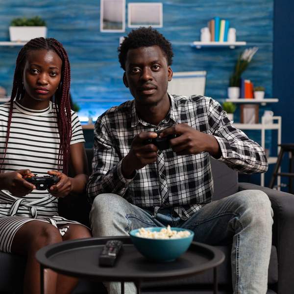 Couple-playing-games-on-couch-together