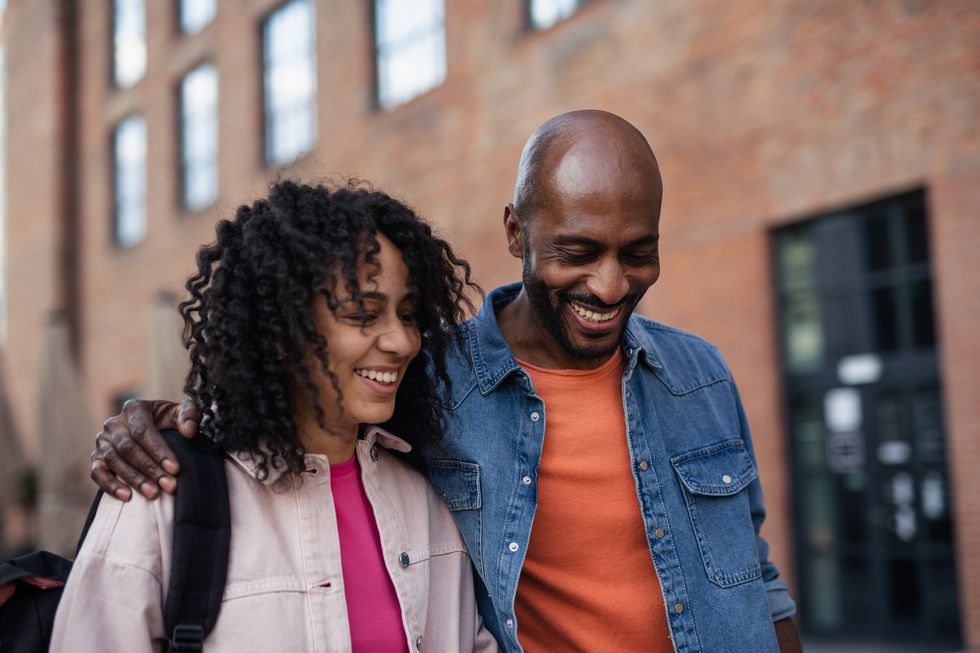 Father-daughter-laughing-on-a-stroll