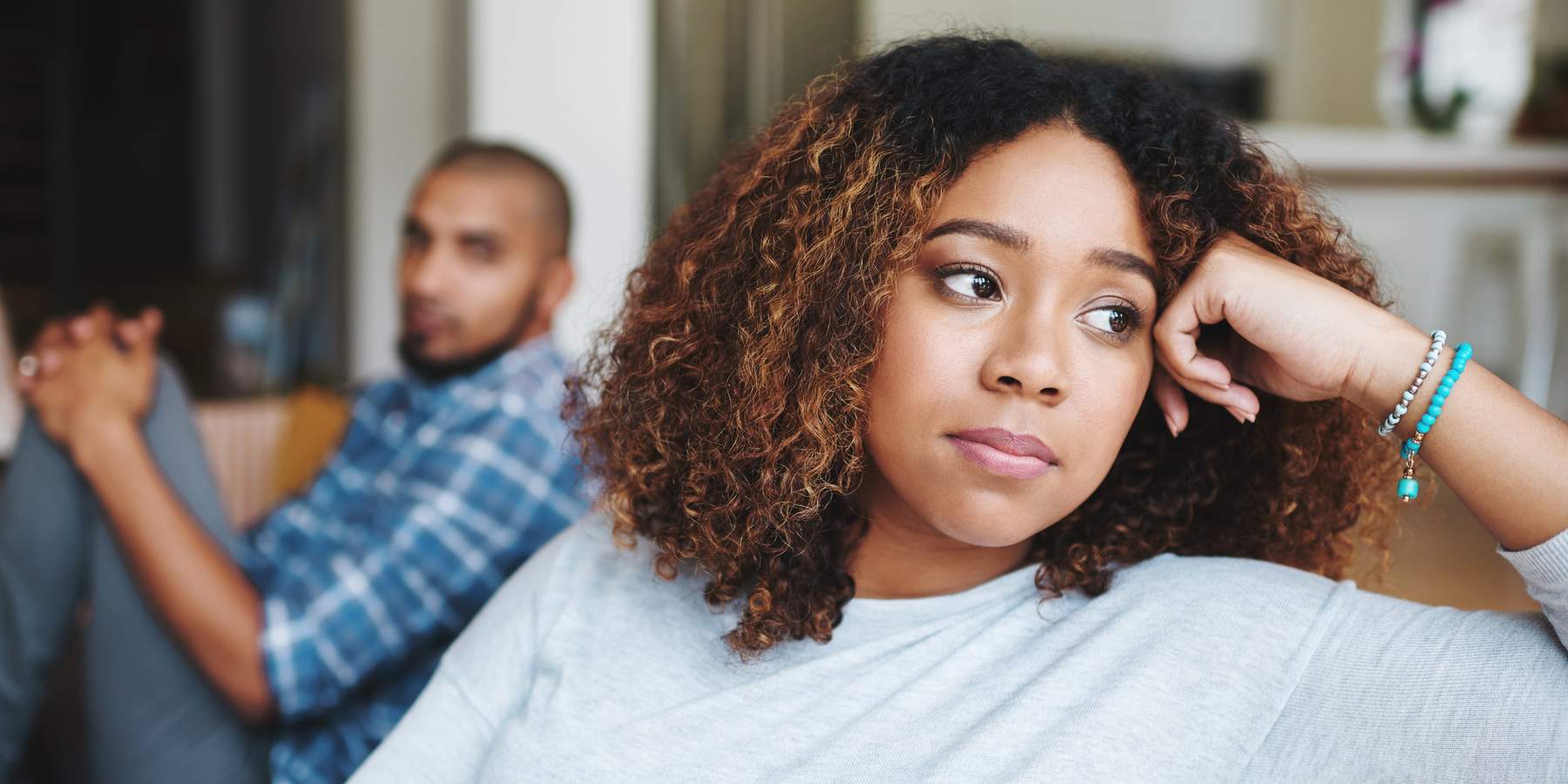 Frustrated couple, ignore and fight with argument on sofa for disagreement, conflict or living room dispute at home. Upset woman, man or separation with affair for breakup or toxic relationship