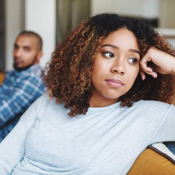 Frustrated couple, ignore and fight with argument on sofa for disagreement, conflict or living room dispute at home. Upset woman, man or separation with affair for breakup or toxic relationship