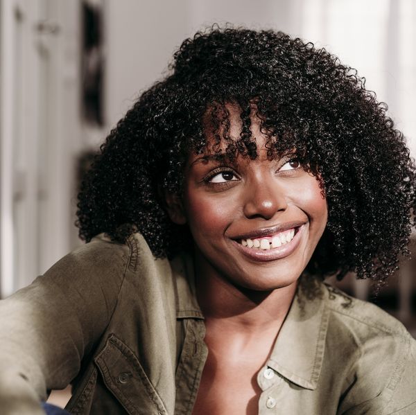 Happy-woman-manifesting-dream-life-at-home