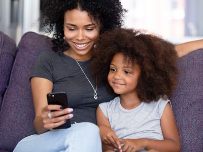 woman and child browsing on phone