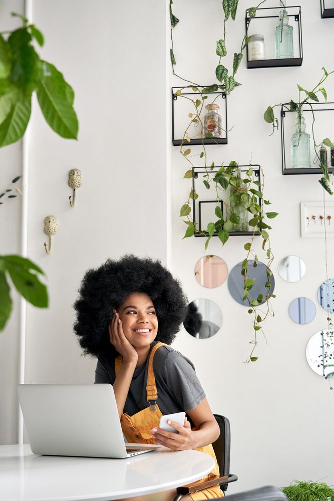 black woman looking out of window
