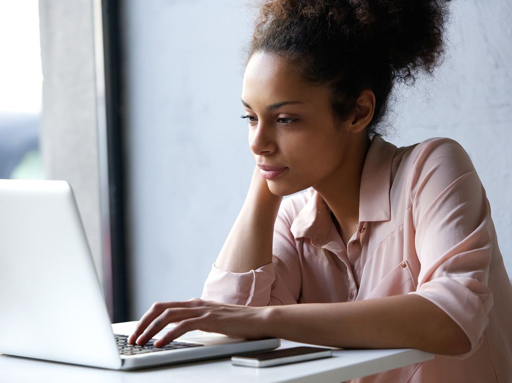 black-woman-searching-on-internet-laptop