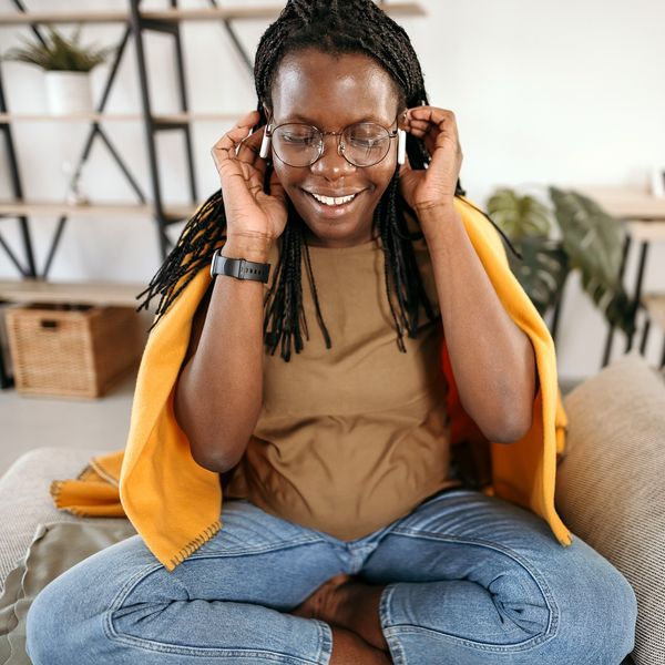 7 Motherhood Podcasts That Keep It All The Way Real