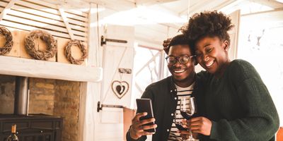 Black couple drinking wine