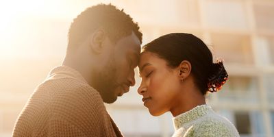 Heterosexual-Black-couple-melting-in-a-loving-embrace-touching-foreheads-with-their-eyes-closed