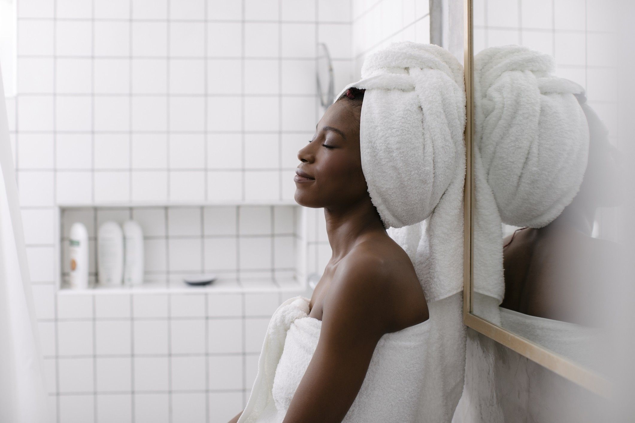 woman-relaxing-in-bath-towel-add-luxury-simple-pleasures-to-your-daily-life