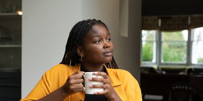 Young-woman-enjoying-solo-date-and-coffee-at-coffee-shop