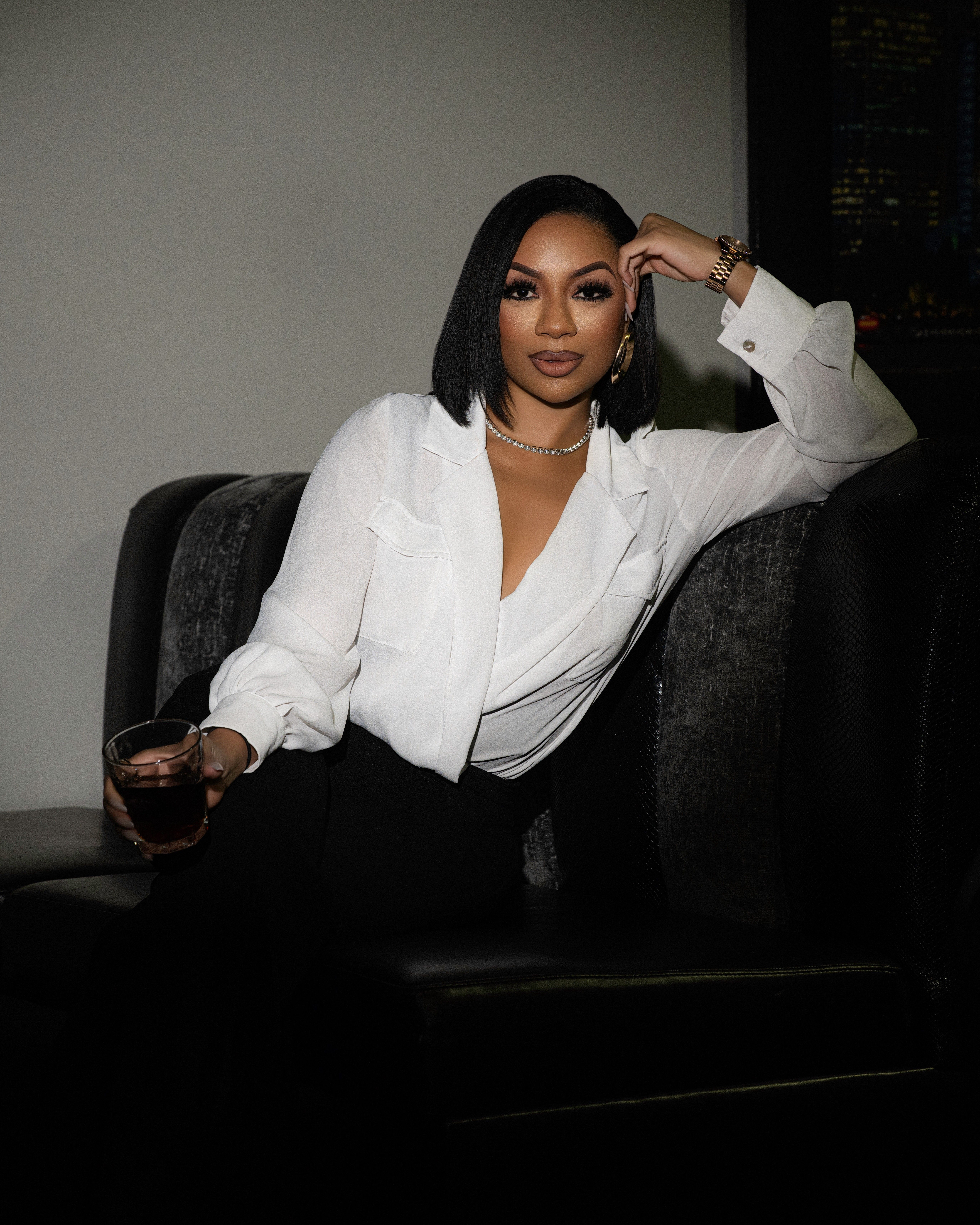 Portrait of xoMAN podcast host Kiara Walker staring confidently at the camera