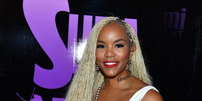 LeToya Luckett smiling confidently, showcasing her balance of career and motherhood