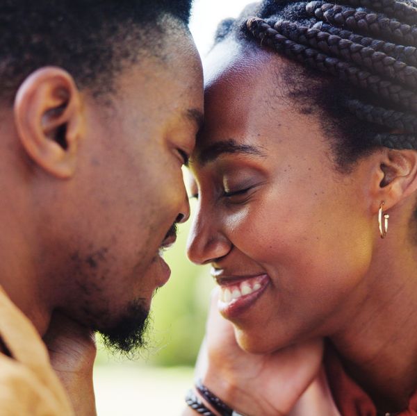 Love, forehead touch and black couple in park together for bonding, relationship and affection in nature. Relax, dating and happy man and woman outdoors for romance, embrace and commitment on weekend
