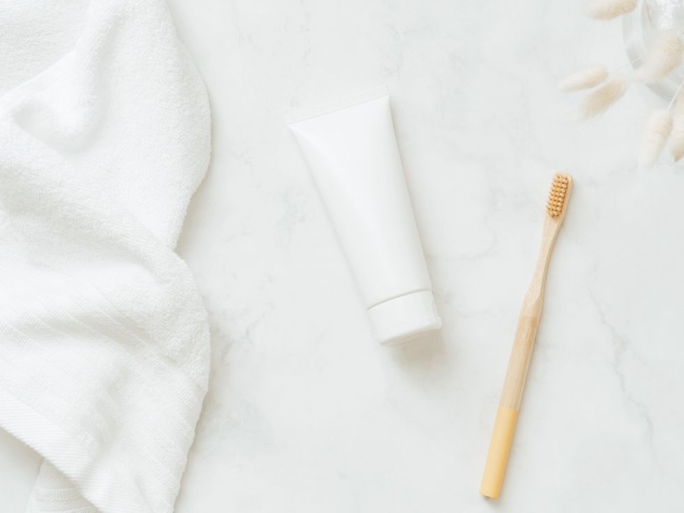 Organic-toothbrush-toothpaste-against-white-background