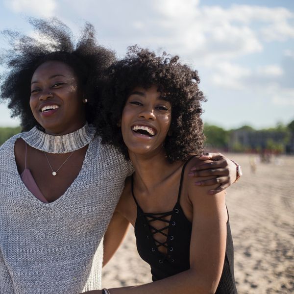 photo-of-black-woman-beside-another-woman-at-seashore