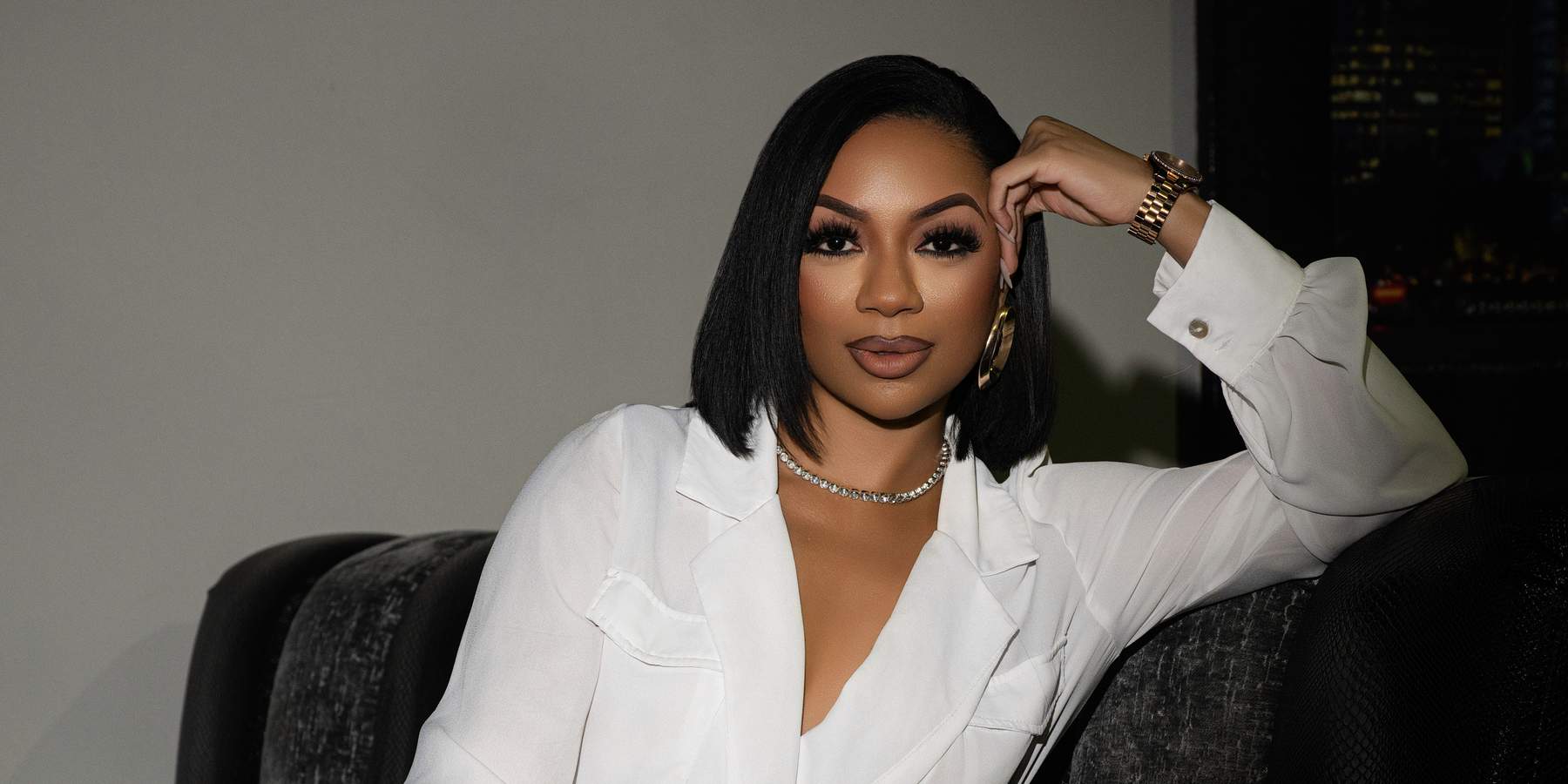 Portrait of xoMAN podcast host Kiara Walker staring confidently at the camera