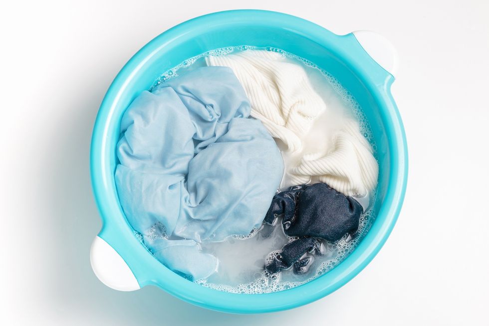 Wet-laundry-getting-soaked-in-a-tub