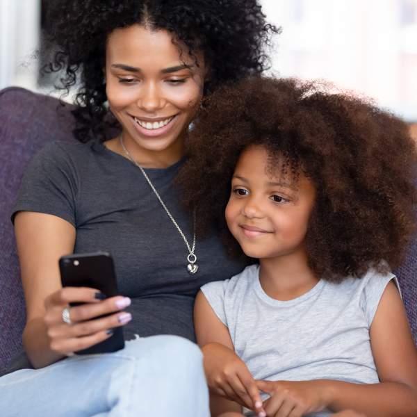 woman and child browsing on phone