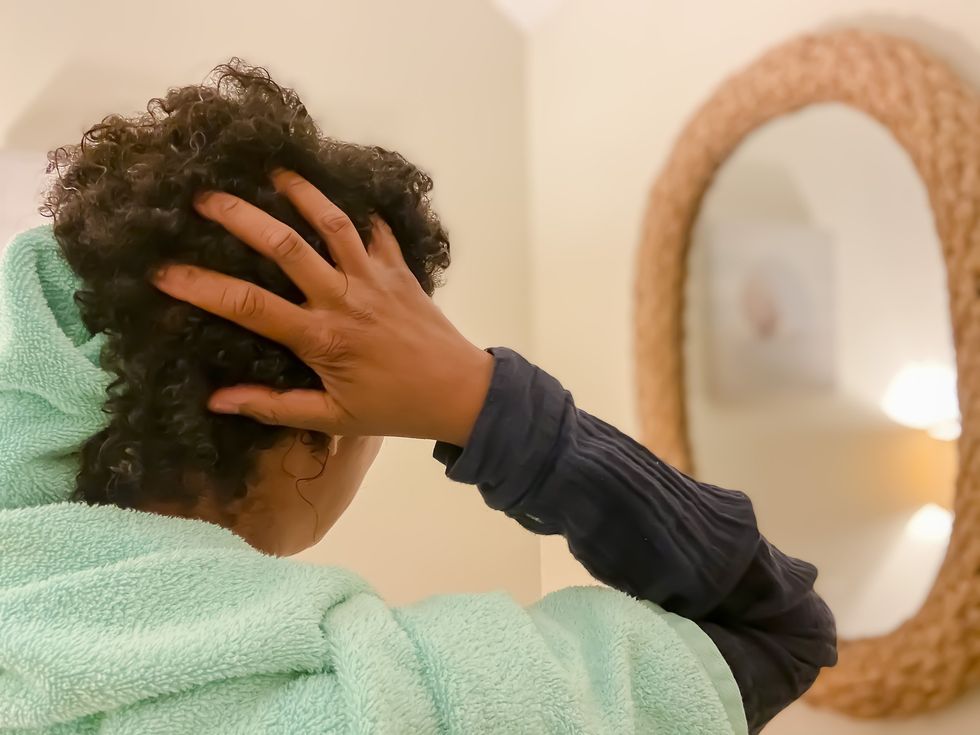Woman-gently-drying-her-wet-hair
