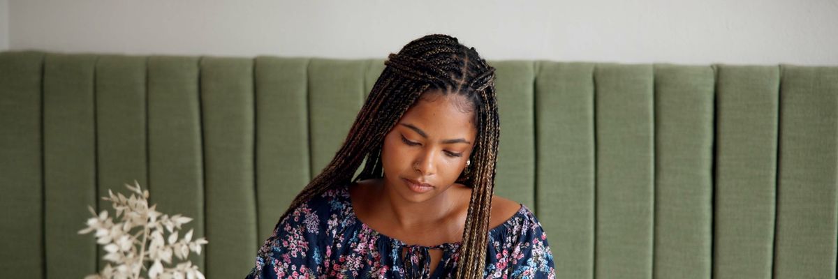 Woman journaling through inner child healing with soft lighting