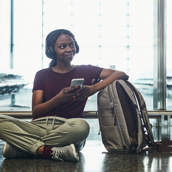 Woman stretching out during layover at airport