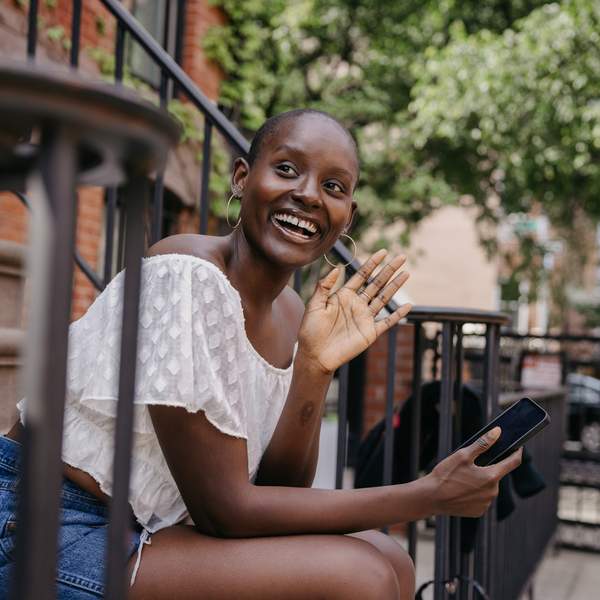 Woman-waiting-sitting-on-steps-outside-her-house
