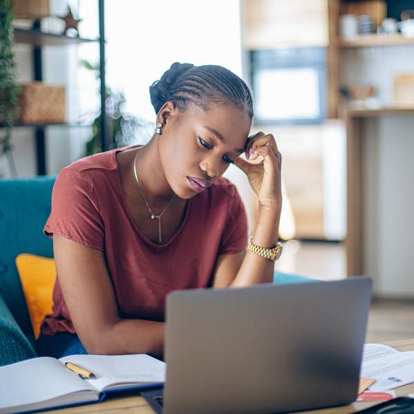 young-African-woman-taking-a-break-from-work-feeling-stressed