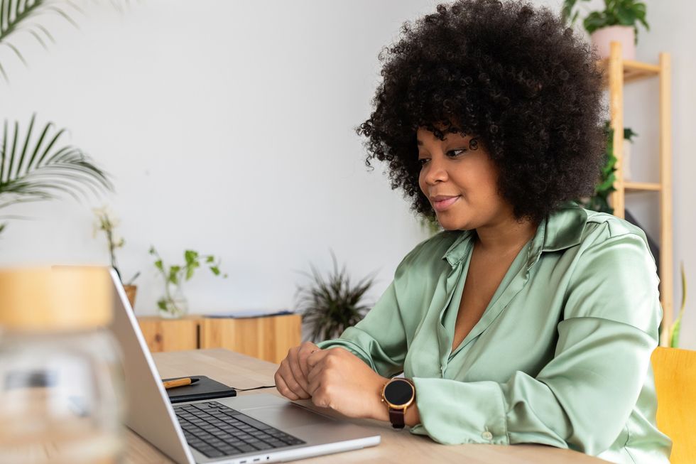 Young-Afro-Latina-having-a-video-call-on-laptop-computer-with-a-therapist