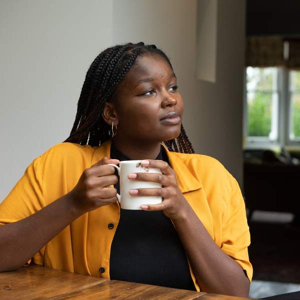 Young-woman-enjoying-solo-date-and-coffee-at-coffee-shop