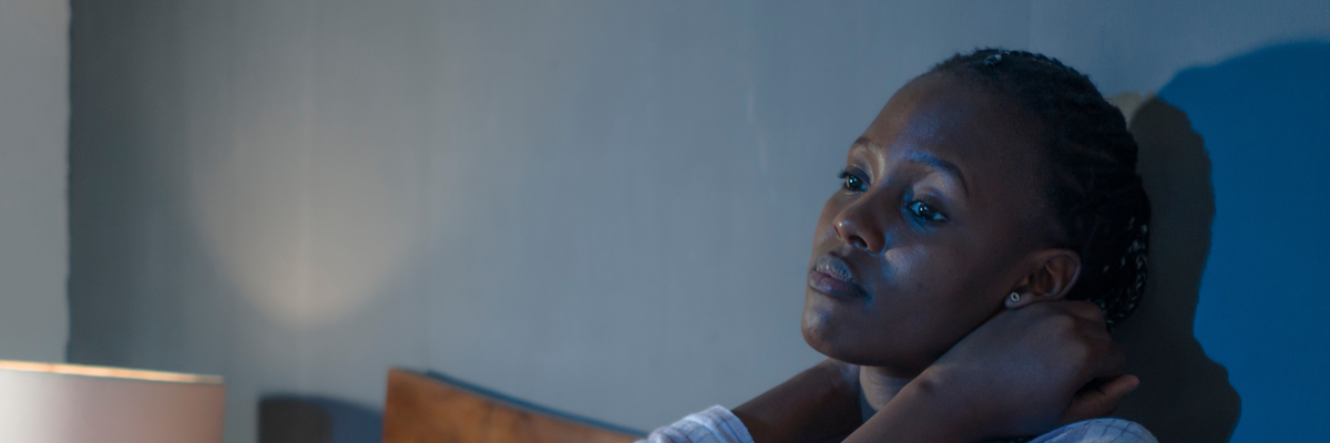 Young woman on bed at home sleepless at night feeling overwhelmed suffering depression problem and insomnia