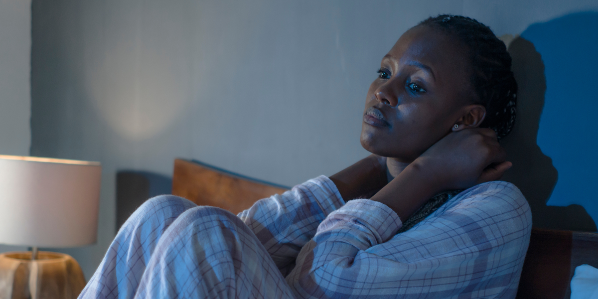 Young woman on bed at home sleepless at night feeling overwhelmed suffering depression problem and insomnia