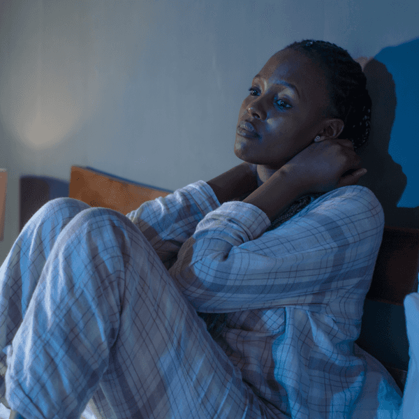 Young woman on bed at home sleepless at night feeling overwhelmed suffering depression problem and insomnia